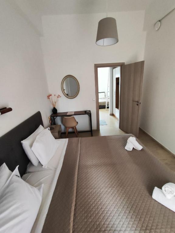 Postel nebo postele na pokoji v ubytování Perix House
