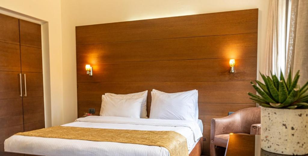 Postel nebo postele na pokoji v ubytování Britannia Suites