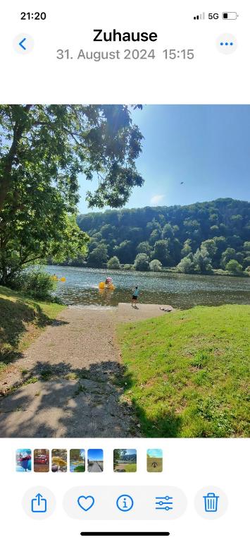 a screenshot of a webpage with a picture of a lake at Pension Rieslingakademie in Mesenich