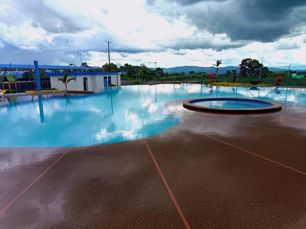 a large empty swimming pool with blue water at Gaia512A in Montenegro