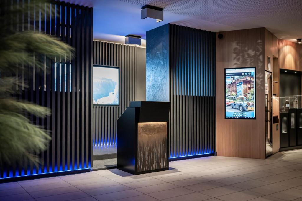 TV a/nebo společenská místnost v ubytování Smart Hotel Saslong