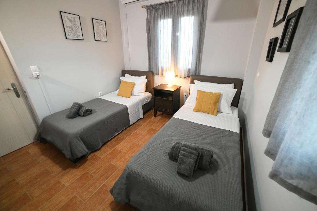 Postel nebo postele na pokoji v ubytování Corinthian Green Villa