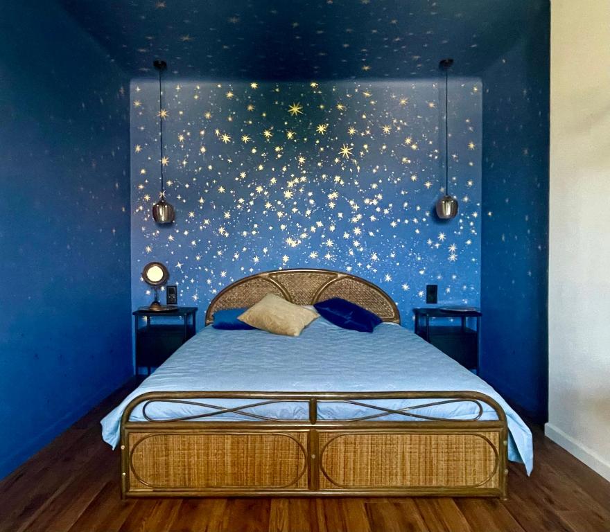 a bedroom with a bed with stars on the wall at Zielona 5 in Lublin