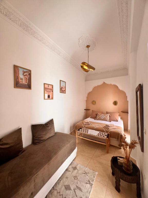 Postel nebo postele na pokoji v ubytování Riad Jardin de Malia
