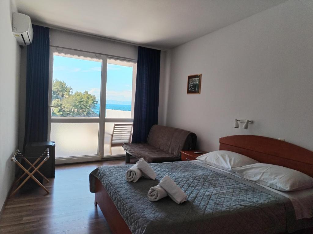 Postel nebo postele na pokoji v ubytování Boarding house Vide