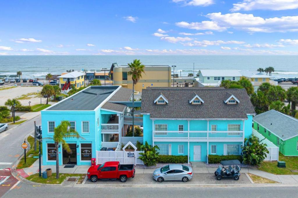 an aerial view of a blue house and the ocean at Beach Bliss Awaits in Flagler Beach