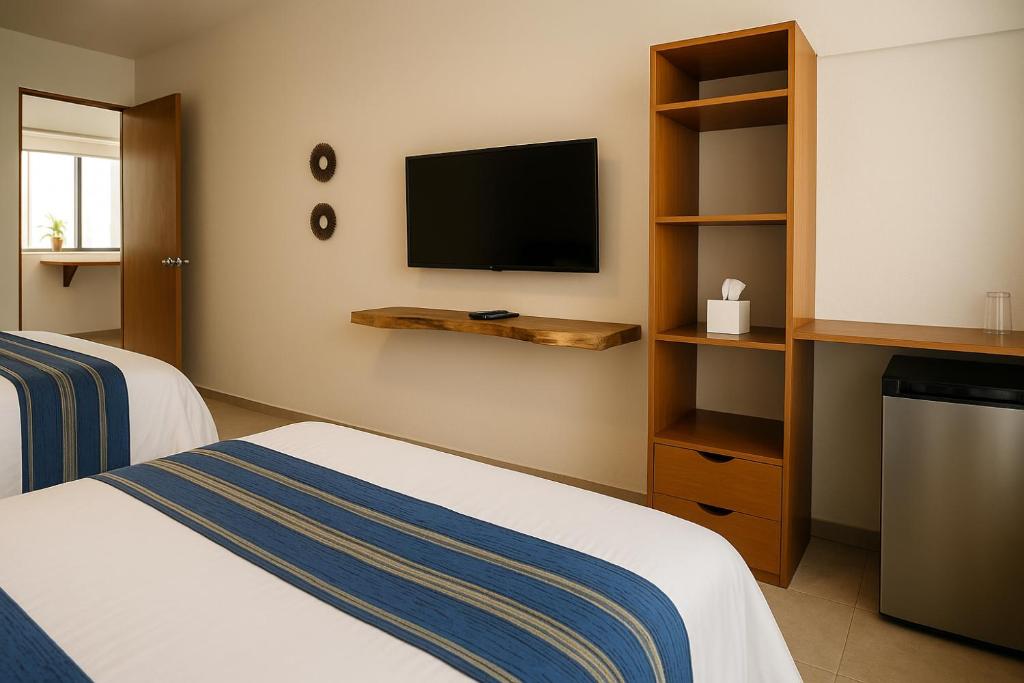 Cama ou camas em um quarto em Villa Sofia Hotel Boutique Cancun