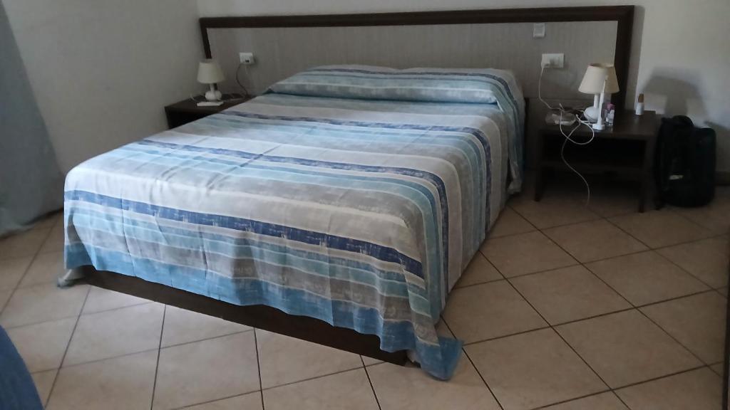 Postel nebo postele na pokoji v ubytování Domo - Guest-House Il Nespolo Fiorito