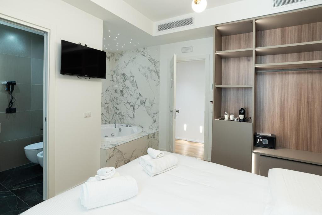 Postel nebo postele na pokoji v ubytování Maison Rasella Palace Suites