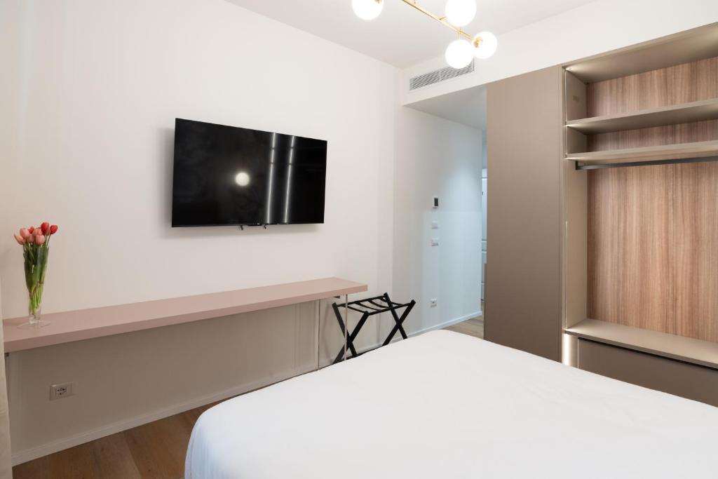 TV a/nebo společenská místnost v ubytování Maison Rasella Palace Suites