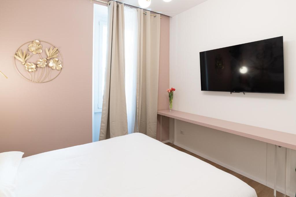 TV a/nebo společenská místnost v ubytování Maison Rasella Palace Suites