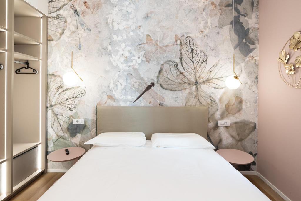Postel nebo postele na pokoji v ubytování Maison Rasella Palace Suites
