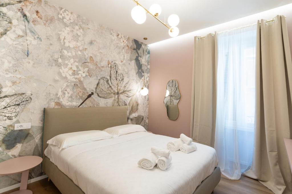 Postel nebo postele na pokoji v ubytování Maison Rasella Palace Suites