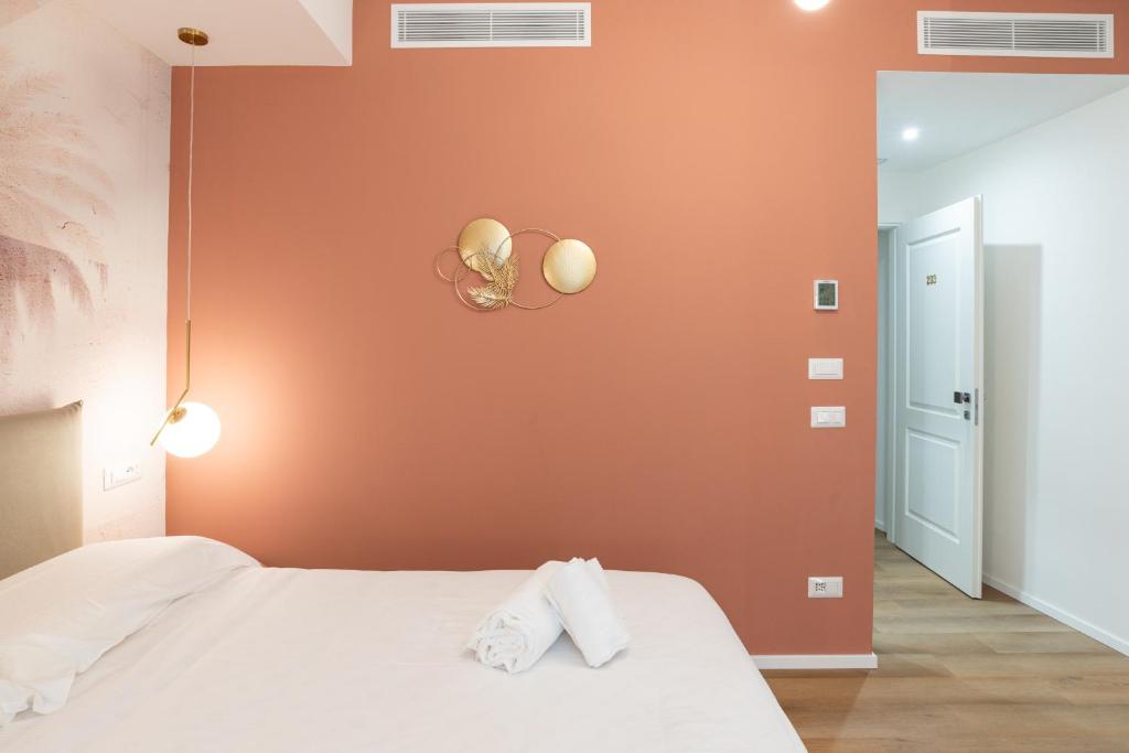 Postel nebo postele na pokoji v ubytování Maison Rasella Palace Suites