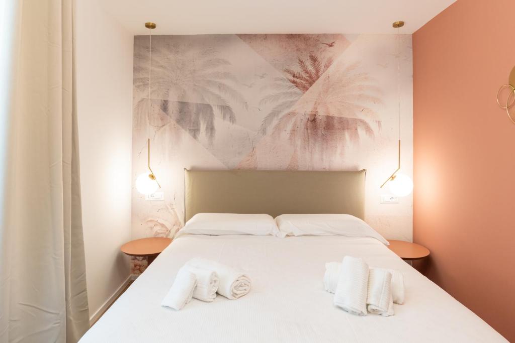 Postel nebo postele na pokoji v ubytování Maison Rasella Palace Suites