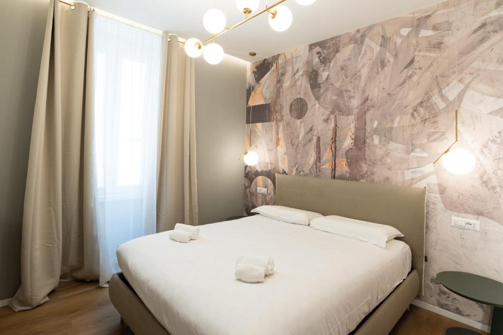 Postel nebo postele na pokoji v ubytování Maison Rasella Palace Suites