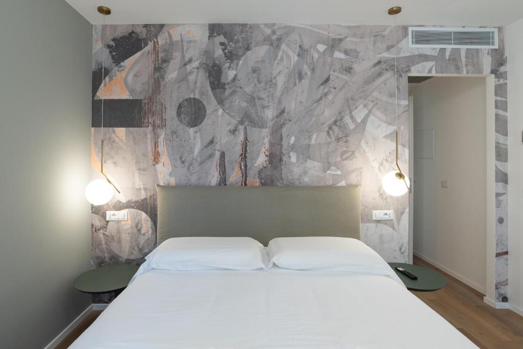 Postel nebo postele na pokoji v ubytování Maison Rasella Palace Suites