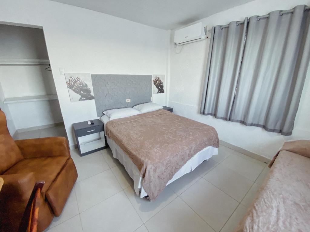 Cama ou camas em um quarto em Hotel 5 Sóis