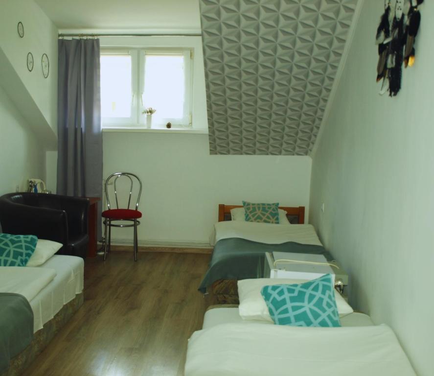 Postel nebo postele na pokoji v ubytování Zibi i Pod Topolami