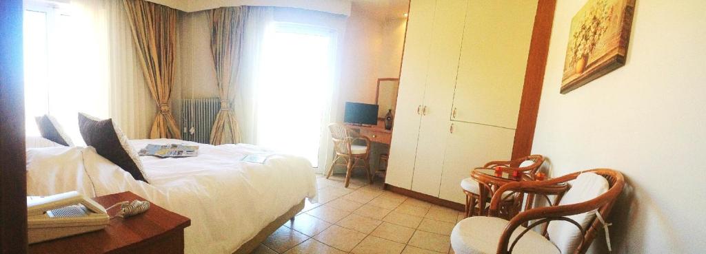 Postel nebo postele na pokoji v ubytování Souris Hotel