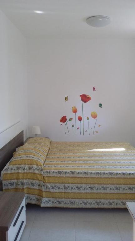 Postel nebo postele na pokoji v ubytování Camping Cala dei Ginepri