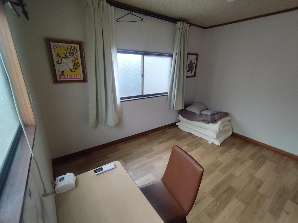 Postel nebo postele na pokoji v ubytování 木の家ゲストハウス前橋3号館