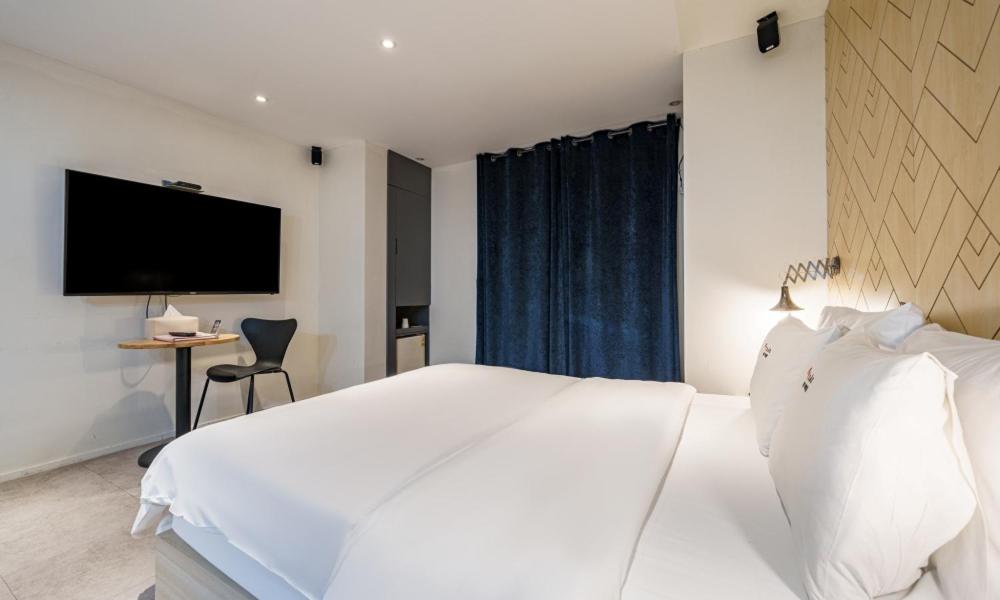 Postel nebo postele na pokoji v ubytování Hotel Yaja Cheongju Terminal Branch