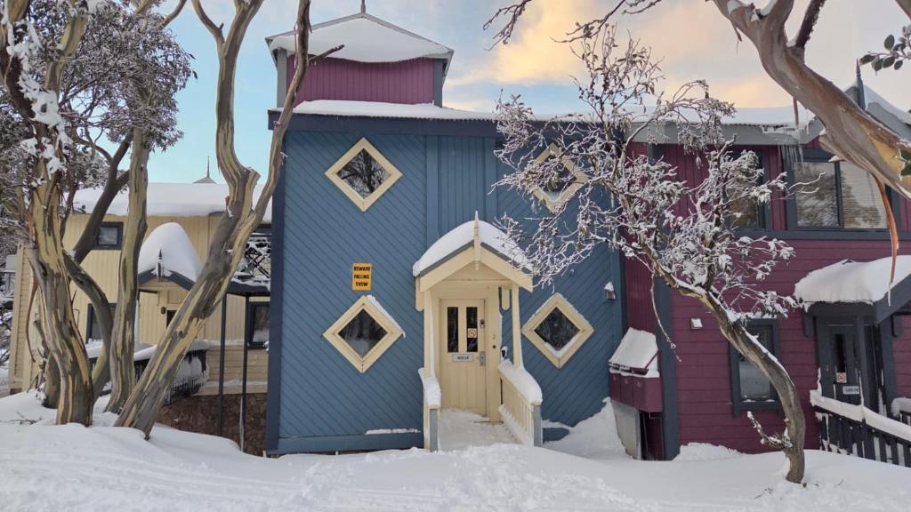 a house in the snow in front of a building at Rangers 2 'Morgan' in Mount Hotham