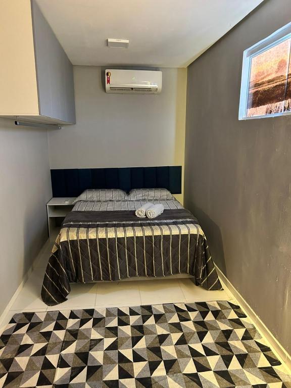 En eller flere senge i et værelse på Estação inverno 2