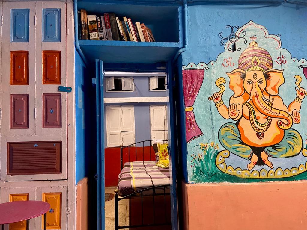 a room with a painting on the wall at Bob hostel in Jodhpur
