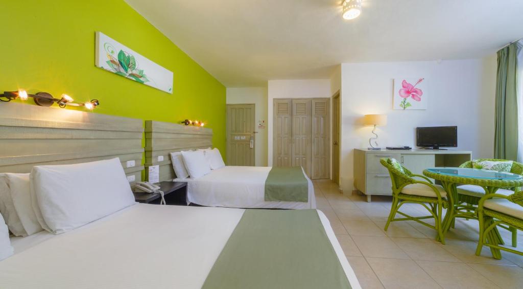 TV a/nebo společenská místnost v ubytování Hotel Villa Taina