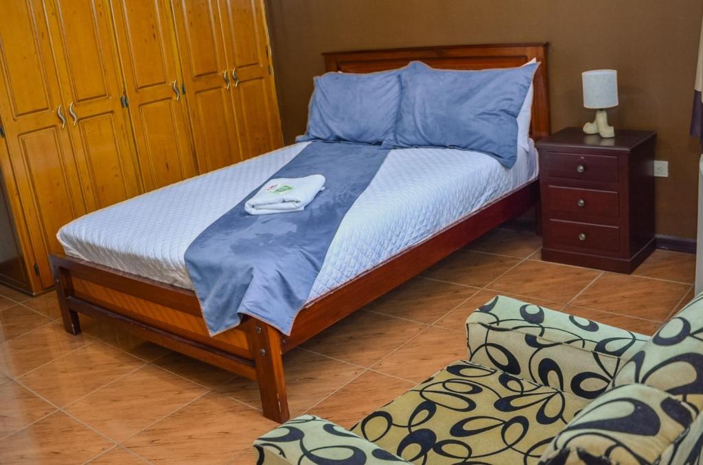 Postel nebo postele na pokoji v ubytování Hotel Miraflores