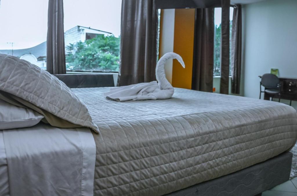 Postel nebo postele na pokoji v ubytování Hotel Miraflores