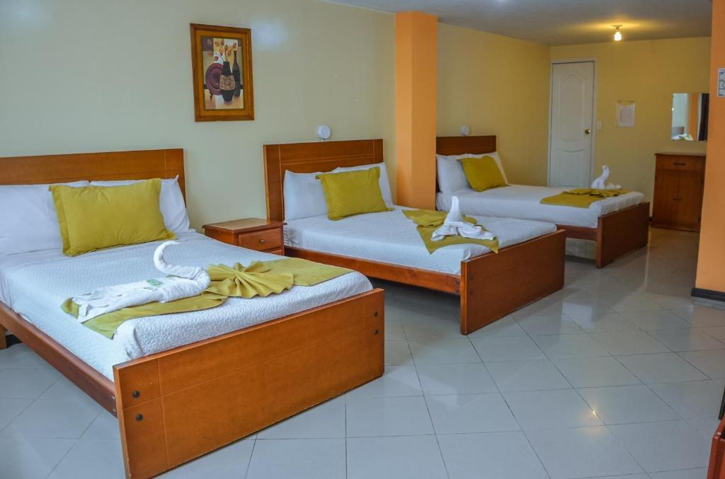 Postel nebo postele na pokoji v ubytování Hotel Miraflores