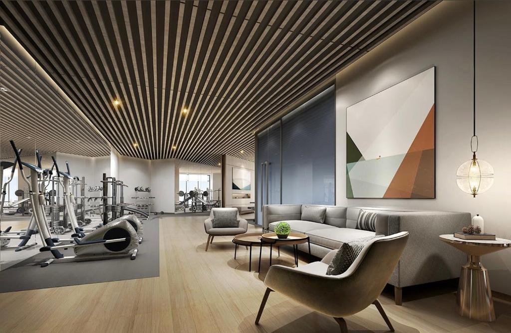 a living room with a couch and a gym at Artisan Ratchada Spacious 2BR Condos in Bangkok