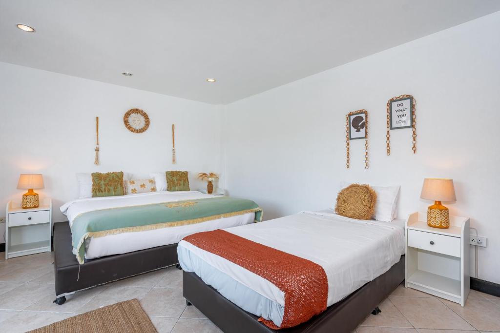 Postel nebo postele na pokoji v ubytování Kata Station Boutique Hotel