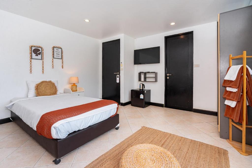 Postel nebo postele na pokoji v ubytování Kata Station Boutique Hotel