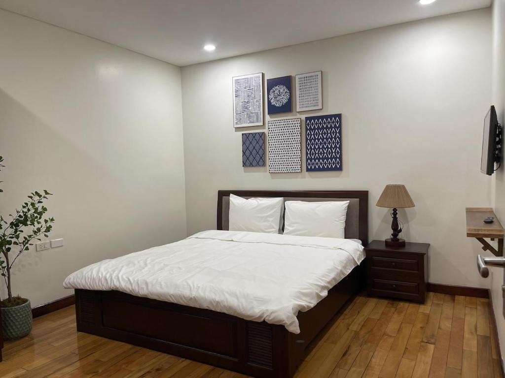 Postel nebo postele na pokoji v ubytování Sakamoto 1 Apartments Kim Ma by XÔI Residences