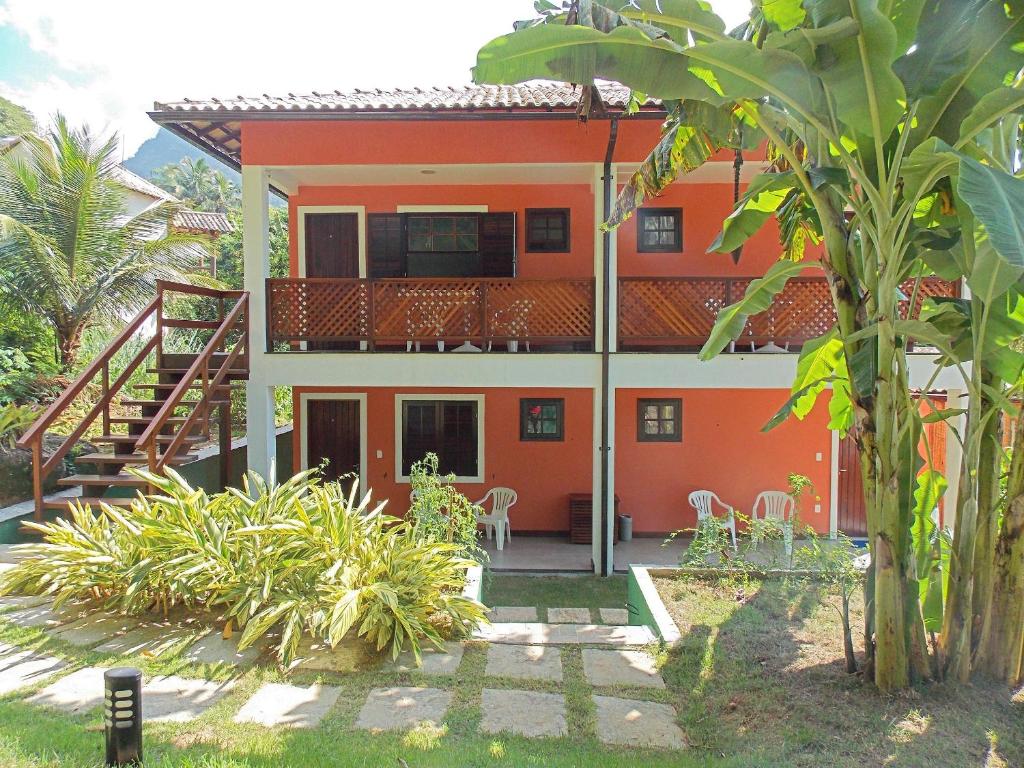 a house with a staircase in front of it at Ancoradouro Flats in Abraão