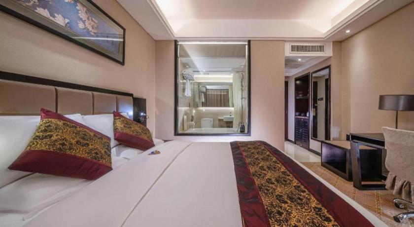 Postel nebo postele na pokoji v ubytování Nanning Yongjiang Hotel