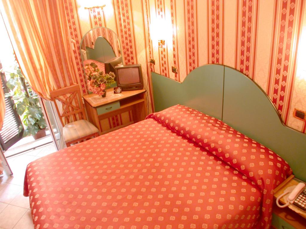 Postel nebo postele na pokoji v ubytování Hotel Hollywood