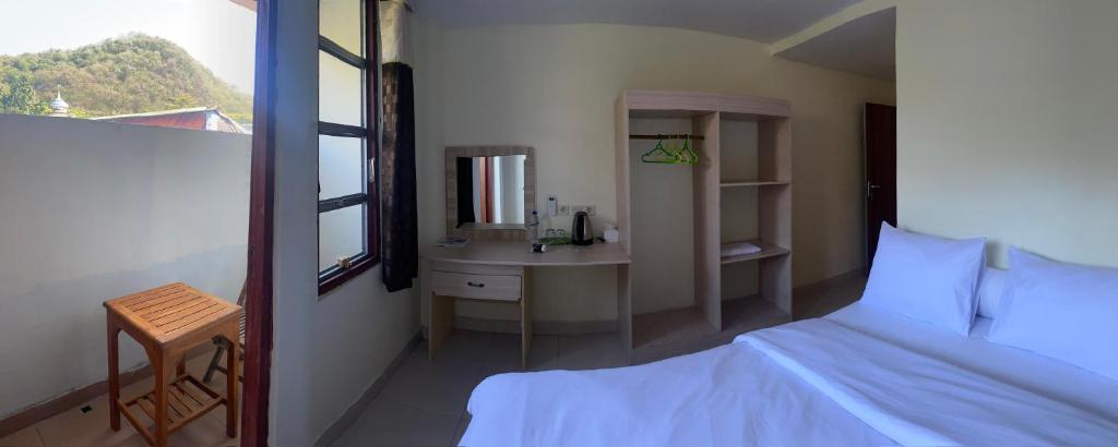 Ένα ή περισσότερα κρεβάτια σε δωμάτιο στο Labuan Bajo room