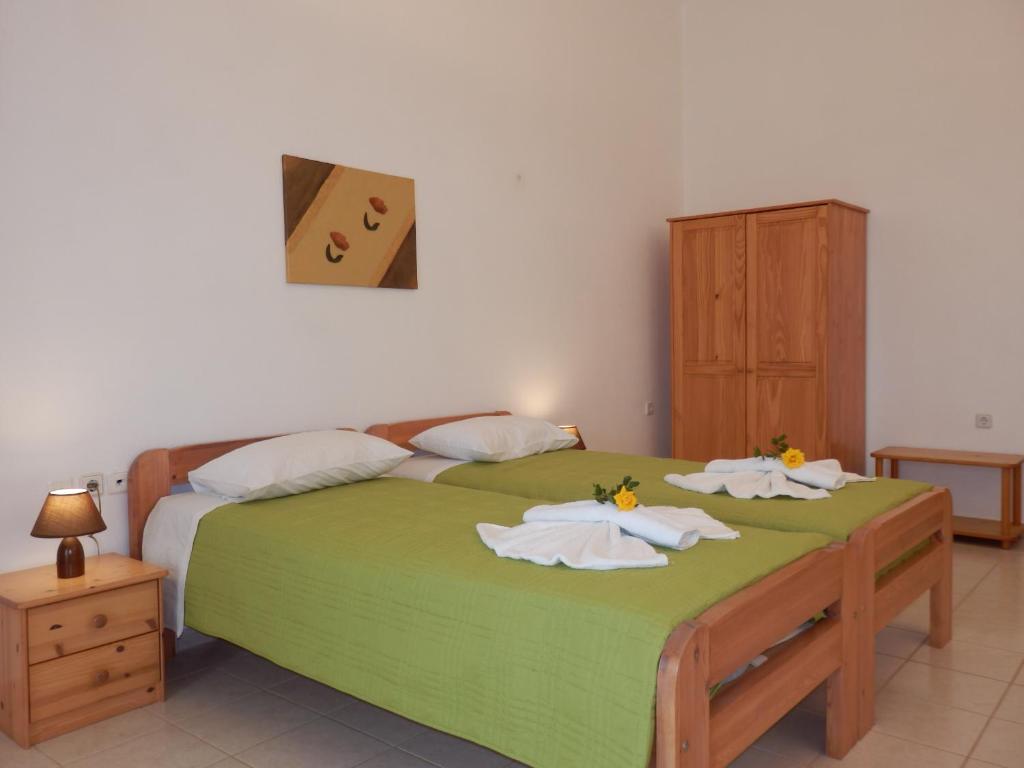 Postel nebo postele na pokoji v ubytování Maro Suites