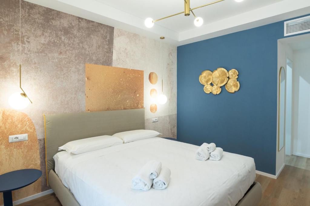 Postel nebo postele na pokoji v ubytování Maison Rasella Palace Suites