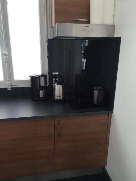 Kuchnia lub aneks kuchenny w obiekcie Appartement Champs Elysées