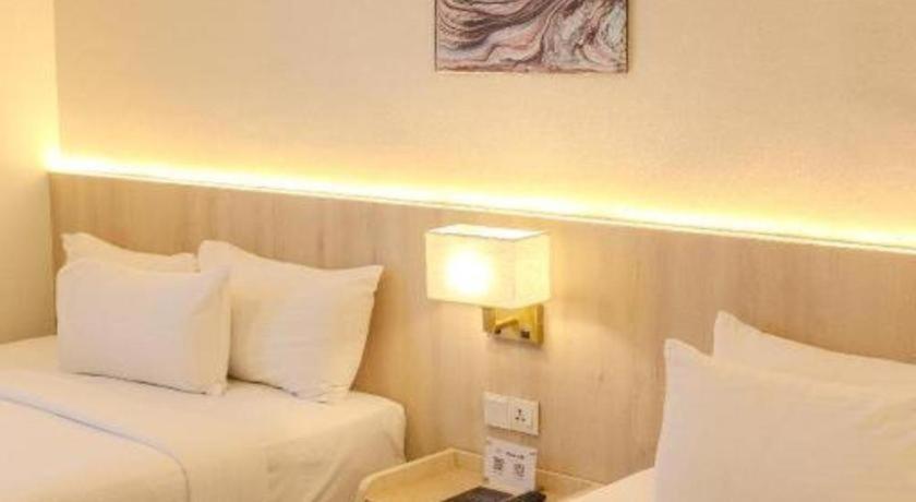 Innspire by Suntai (Previously known as WG Hotel)にあるベッド