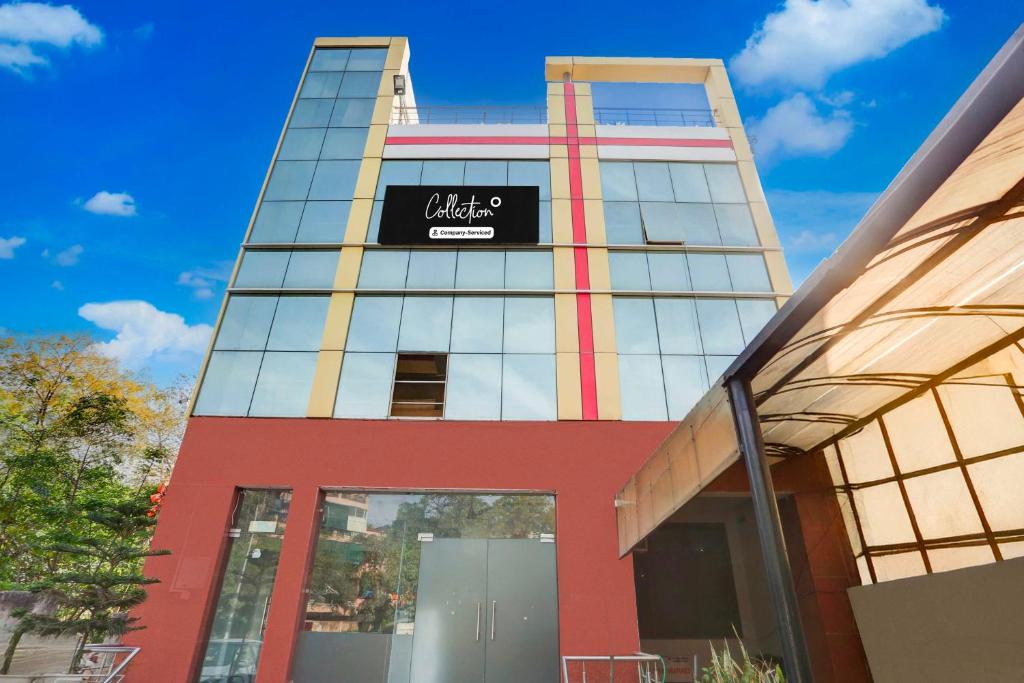 a tall building with a sign on it at Collection O Sector 4 Gurgaon in Gurgaon