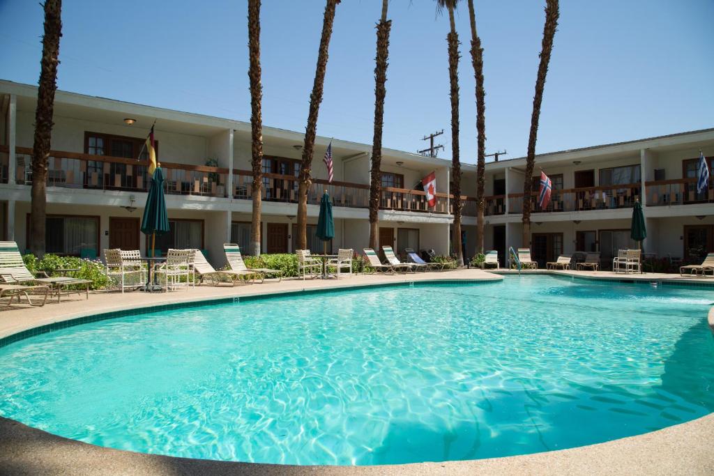 a large swimming pool in front of a hotel at The Inn at Deep Canyon in Palm Desert