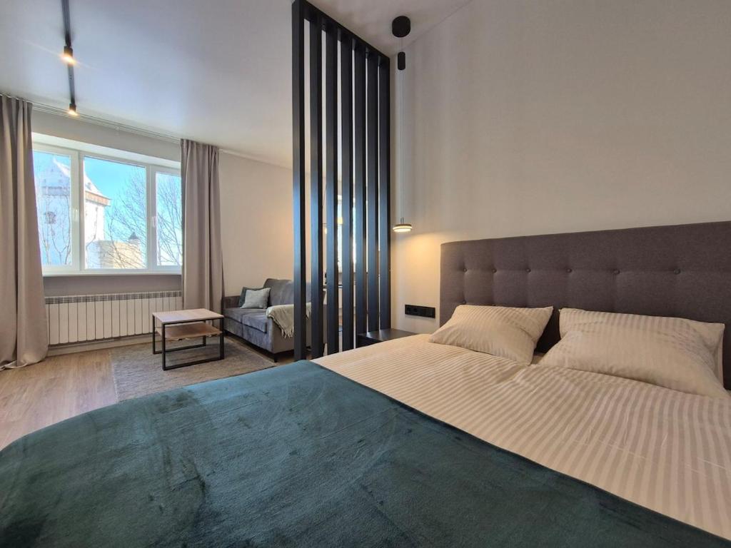 Postel nebo postele na pokoji v ubytování Apartment with Narva Castle view