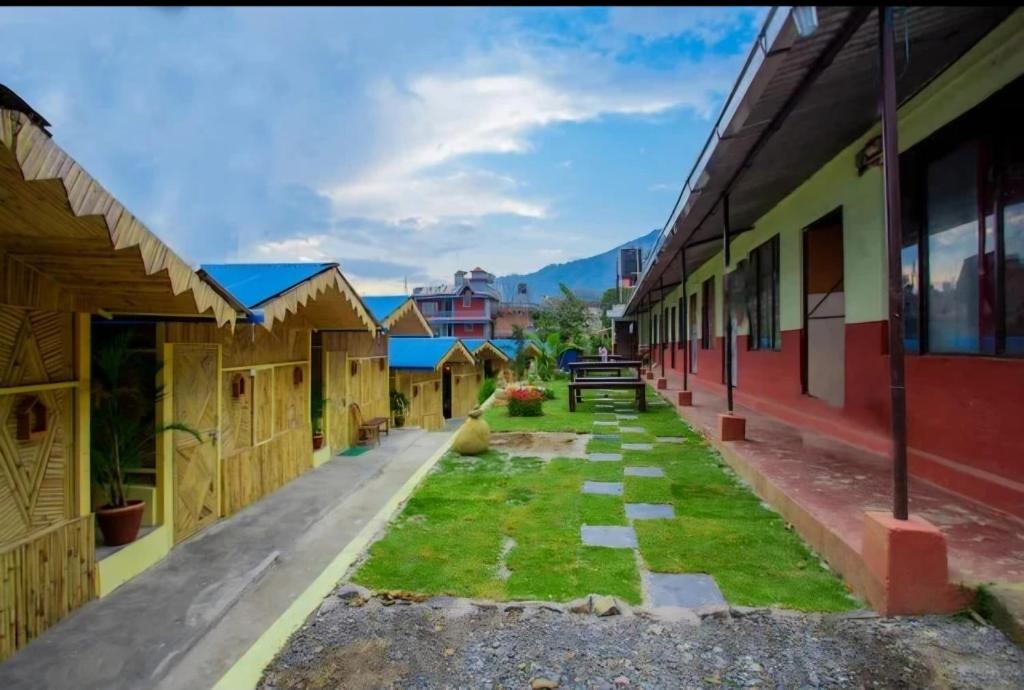 a view of the courtyard of a school building at Babylon Bamboo Cottage in Pokhara